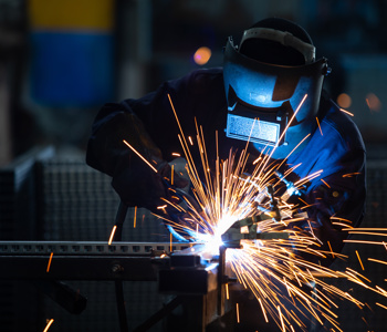 An industrial welder at work